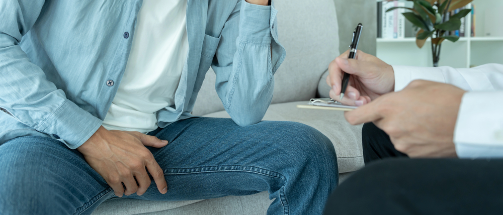Man feeling discomfort and consult doctor - Erectile Dysfunction concept